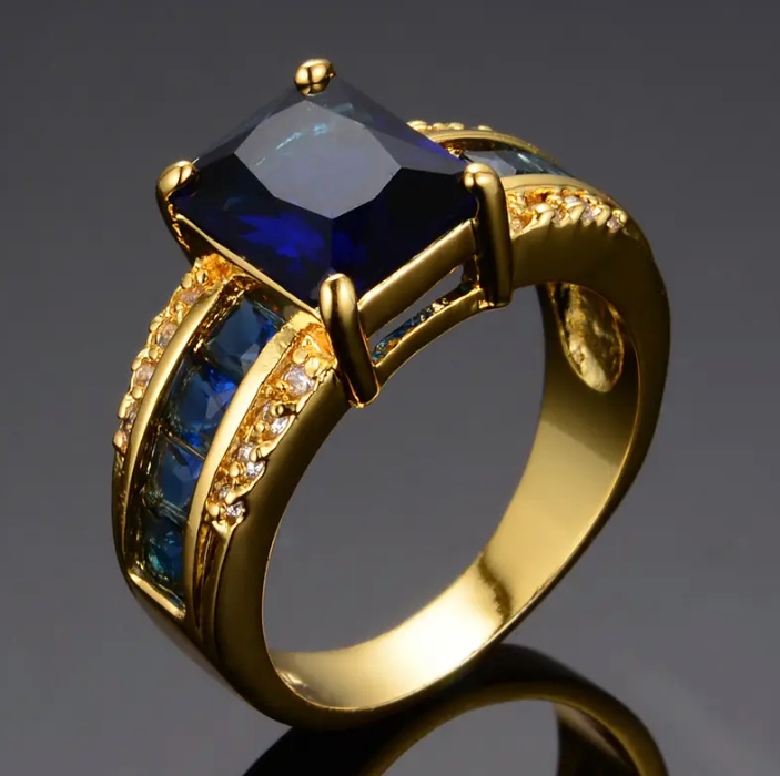 Anel Kassira Safira Dourado